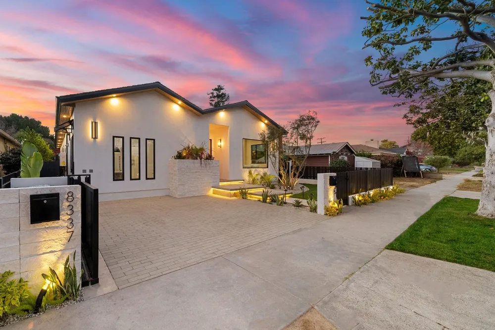 Exterior home lighting illuminating Council Bluffs residence at night