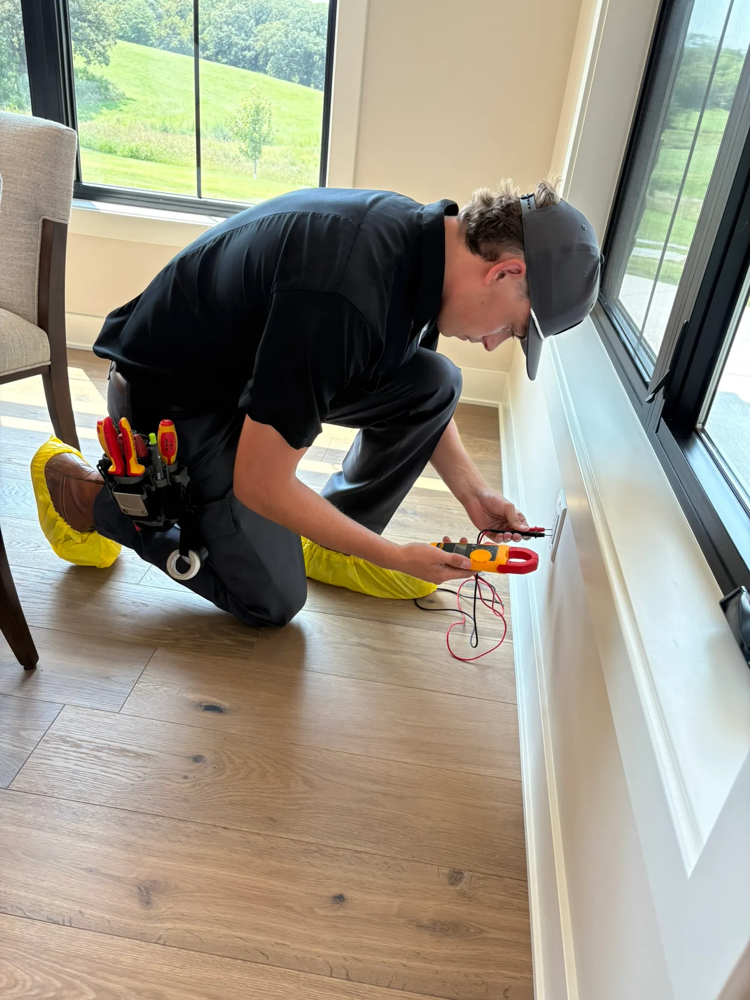 Bluffs Electric electrician performing an electrical panel upgrade in a Council Bluffs home