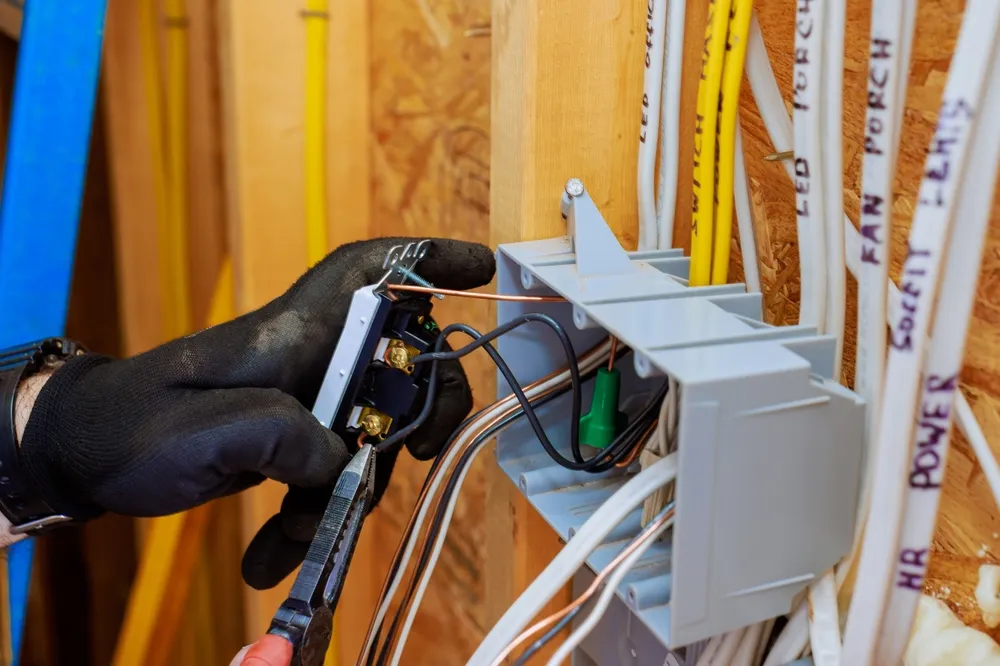 Electrical outlet installation during code compliance renovation