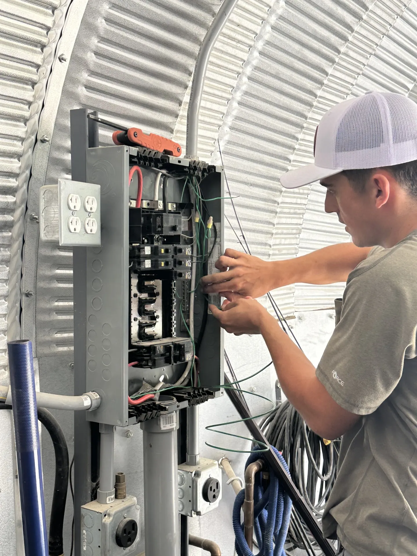Bluffs Electric technician working on an electrical panel